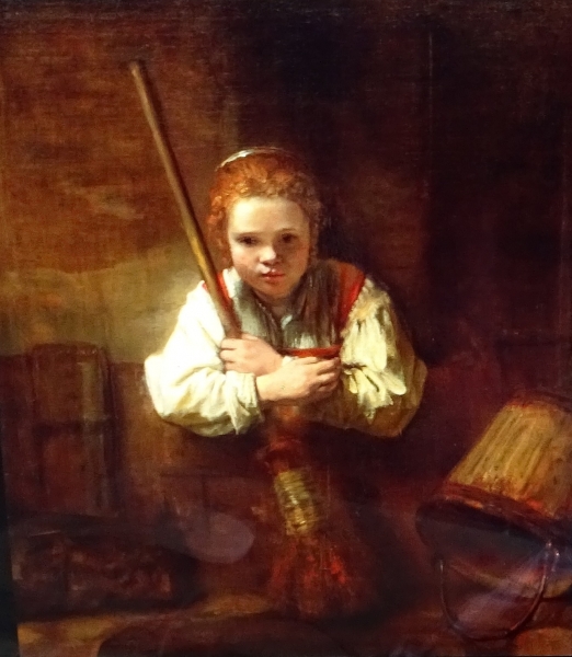 Une fille avec un balai