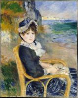 Femme assise au bord de la mer